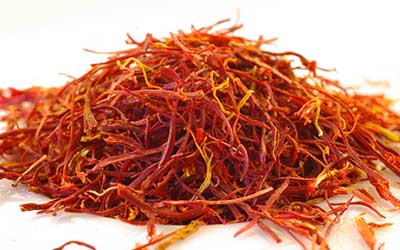 mountain of deep orange-red saffron threads.