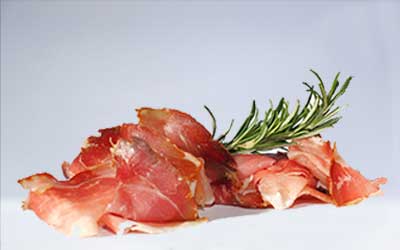 slices of ham with rosemary
